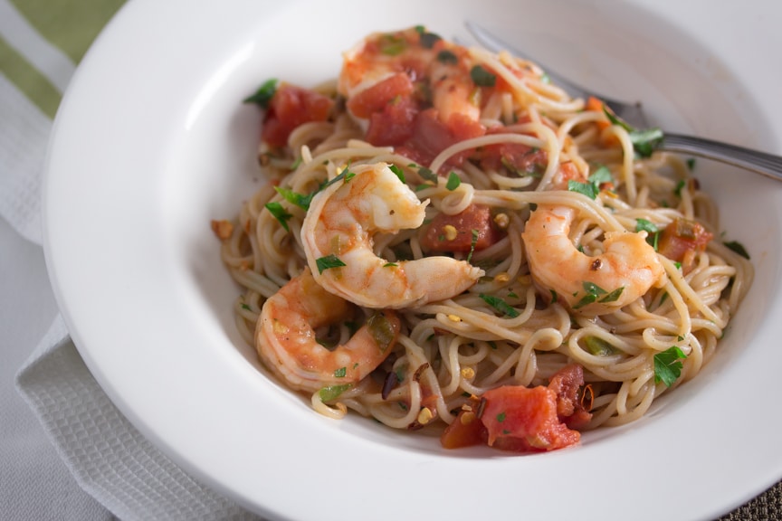 Low FODMAP Capellini and Shrimp Fra Diavolo in a white bowl