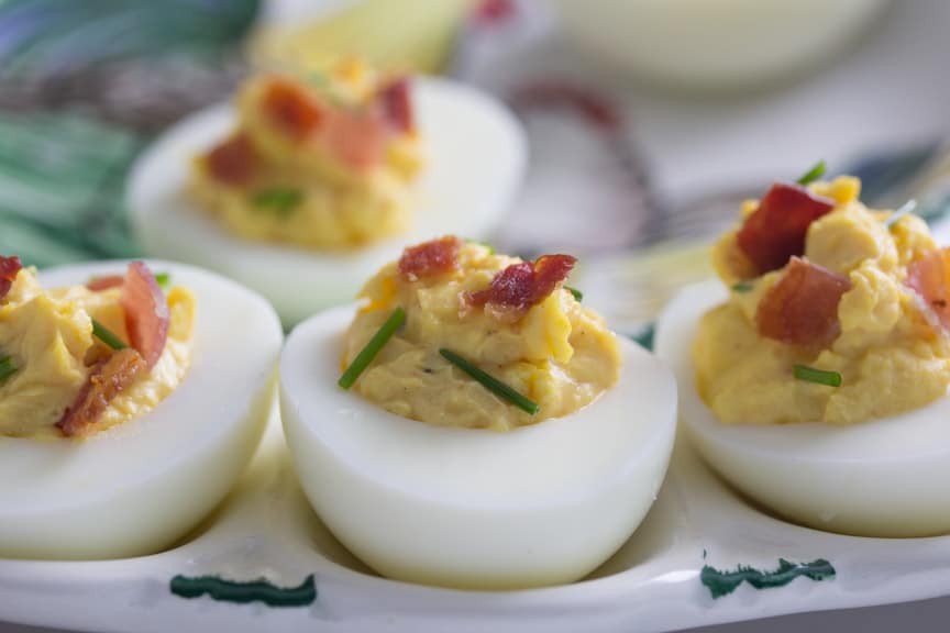 Monash University Certified Low FODMAP Bacon Deviled Eggs - no one passes these by! A lovely, simple and very tasty Low FODMAP appetizer. For more Low FODMAP recipes visit us.