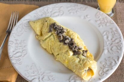 Low FODMAP mushroom omelet on white plate