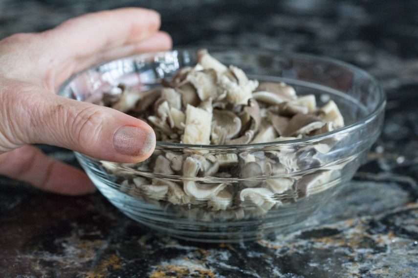 chopped oyster mushrooms in a glass bowl