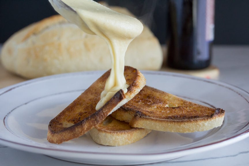 Welsh Rarebit cheese generously ladled over well toasted bread. 