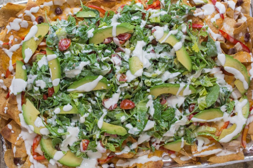 A riot of color and texture and taste - Salad Nachos ready to be eaten! Low FODMAP and safe for Elimination!