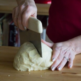 pie crust being cut into two halves