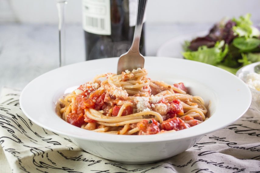 Pasta all’Amatriciana in a white bowl