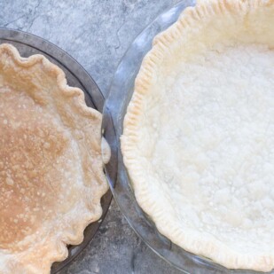Blind baked pie crusts. A fully baked crust on the left and a partially baked crust on the right.