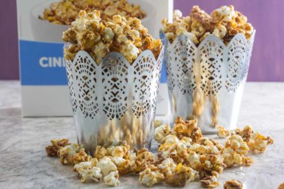 FODY Sweet n Salty caramel Popcorn spilling out of decorative silver containers