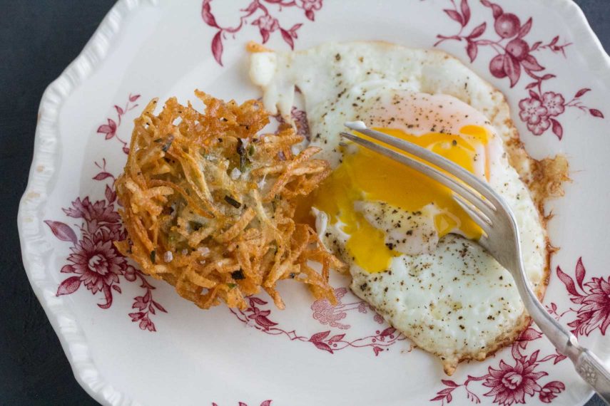 potato latke with fried egg, with a runny egg yolk
