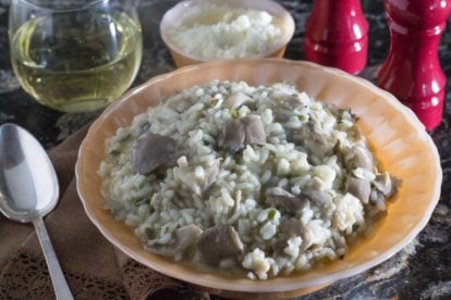 oyster mushroom risotto in an antique bowl with fluted edge