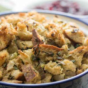 closeup of low FODMAP simple sourdough stuffing in a blue and white casserole dish