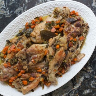 Braised turkey wings with white wine on a platter