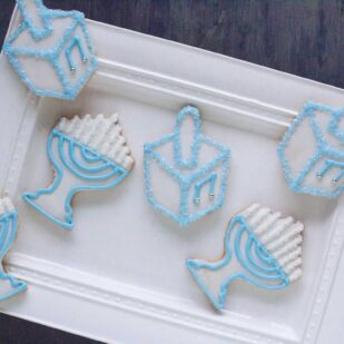 Hanukkah cookies on rectangular white plate