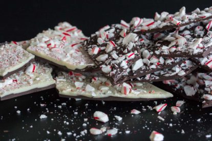 Peppermint bark in a pile against dark background