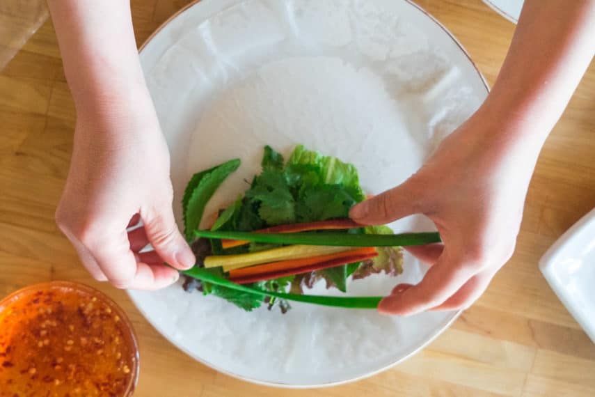 adding carrots and scallion greens to summer rolls