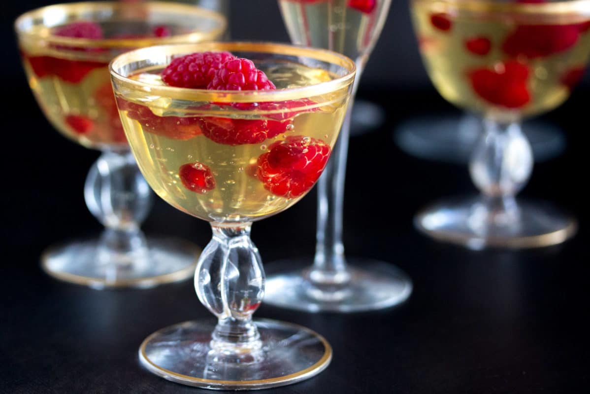 champagne gelee with raspberries & pomegranate closeup PROMO