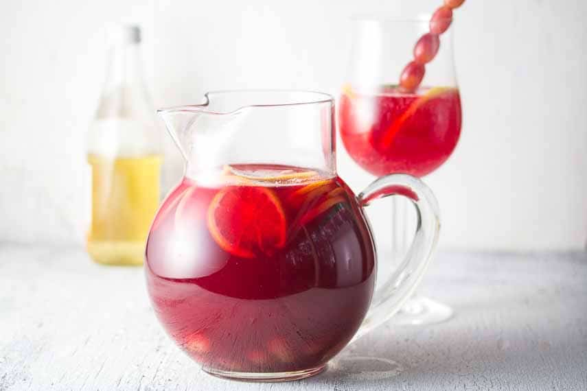 Sparkling Ginger Cranberry Punch in pitcher and glass