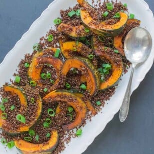 kabocha with crispy quinoa crumbs overhead shot on oval white platter