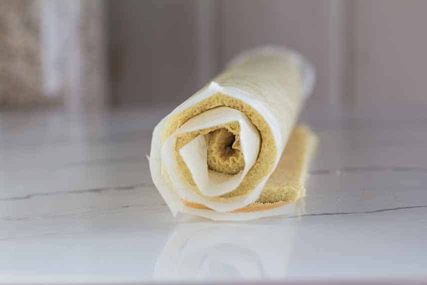 sponge cake roll for bûche de noël, rolled up.