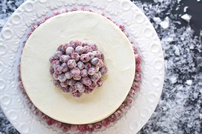 A birds eye view of Red Velvet Cake with Sugared Cranberries & White Chocolate Frosting