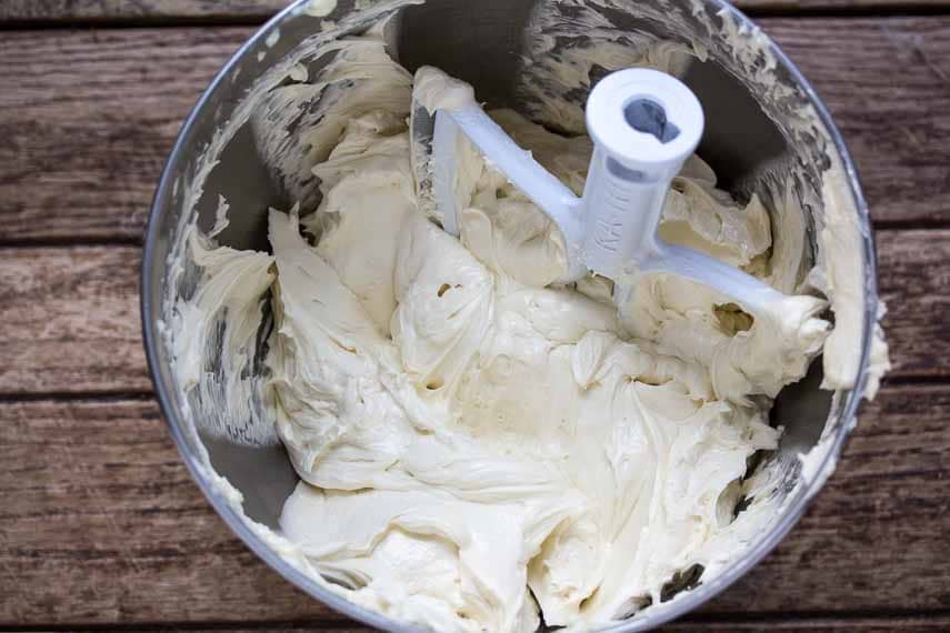 whole egg French buttercream in mixing bowl with flat paddle