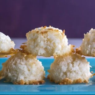 closeup of simple coconut macaroons on blue plate