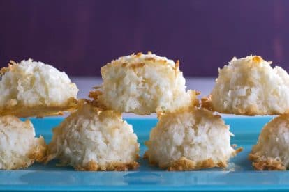 closeup of simple coconut macaroons on blue plate