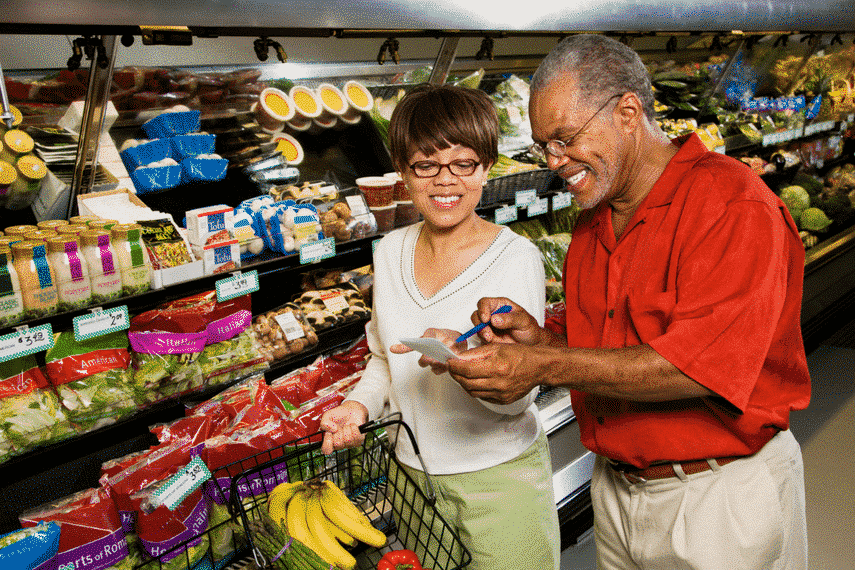 A couple shopping in a supermarket.