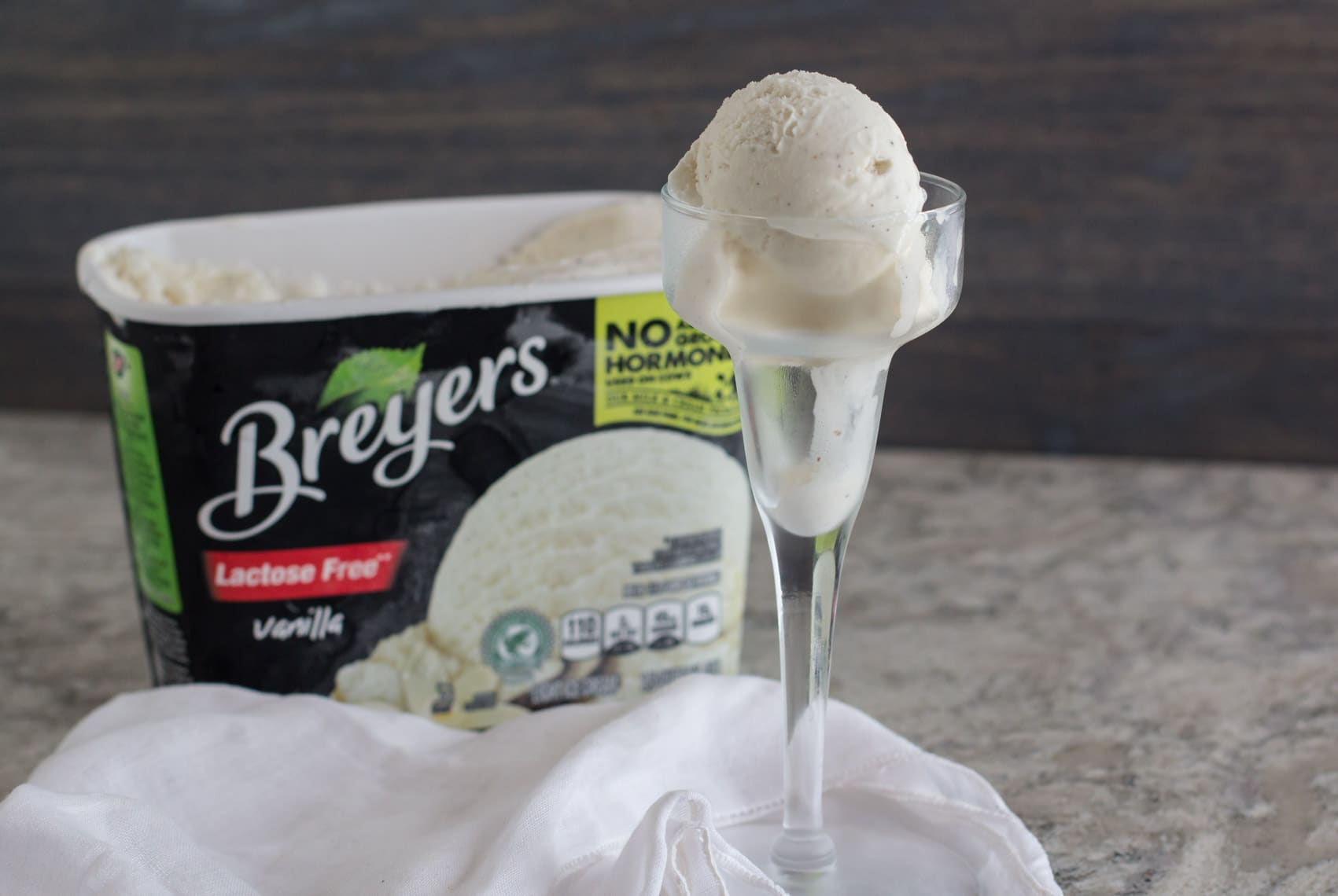 breyers lactose-free vanilla ice cream in a tall glass dish