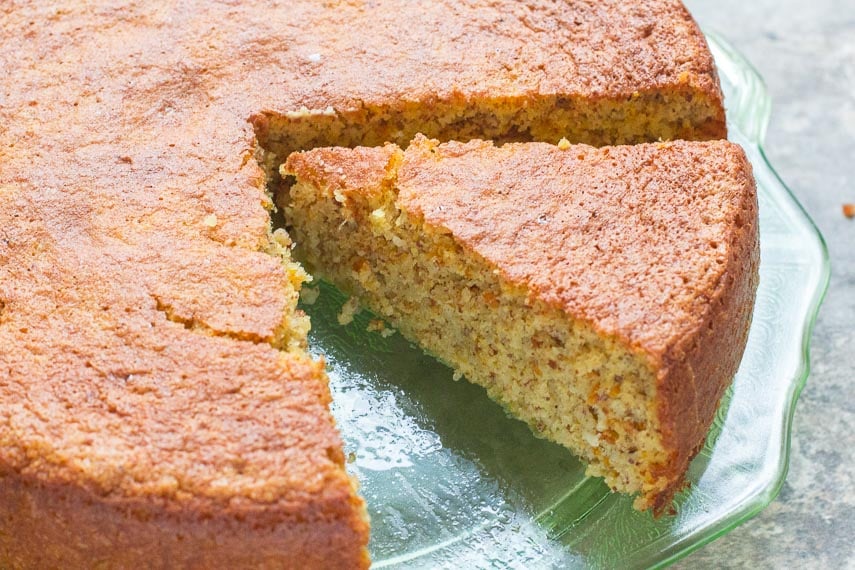 clementine almond cake; wedge cut out on green glass plate