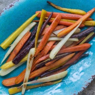 roasted & glazed carrots, rainbow carrots, on an aqua oval platter