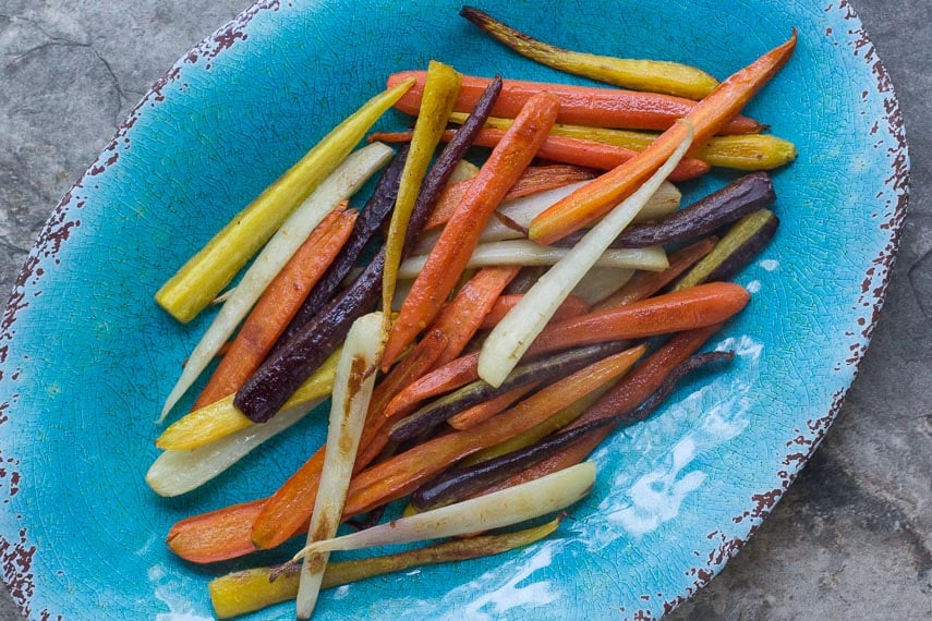 roasted & glazed carrots, rainbow carrots, on an aqua oval platter