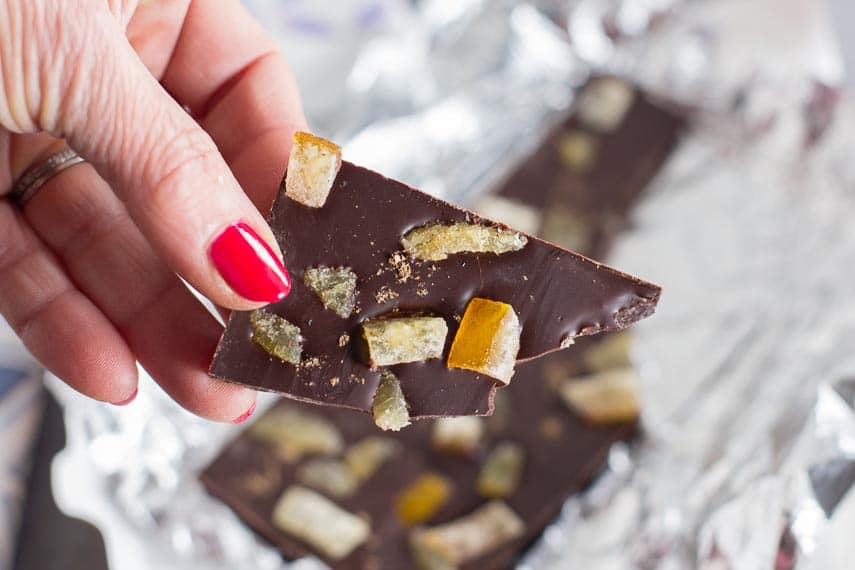 Piece of Ethereal Confections Dark Chocolate Topped with Candied Ginger, Candied Orange Peel & Coriander