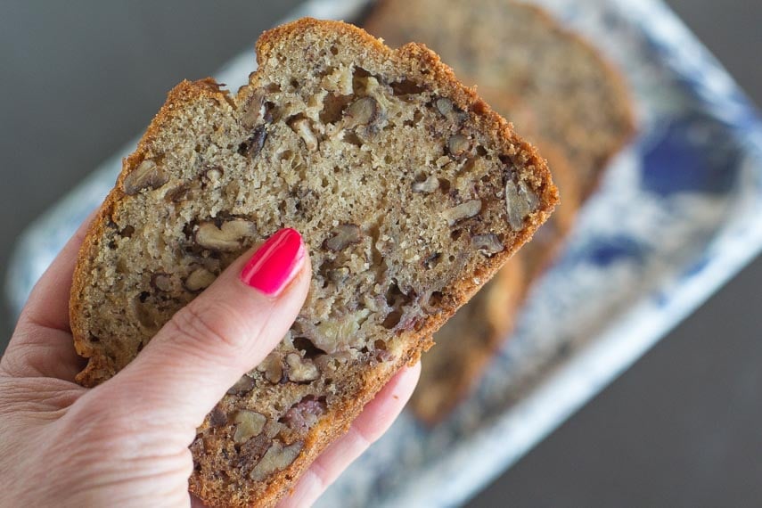 slice of reduced sugar banana bread in hand