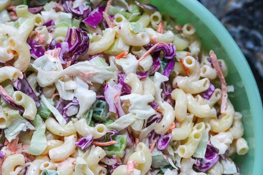 closeup of macaroni slaw in a green bowl