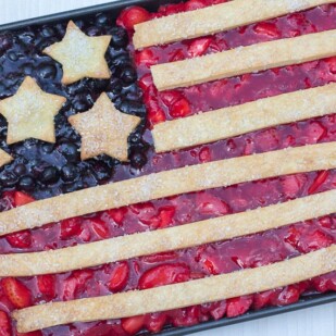 Flag Slab Pie in a baking pan against a white and gray quartz background
