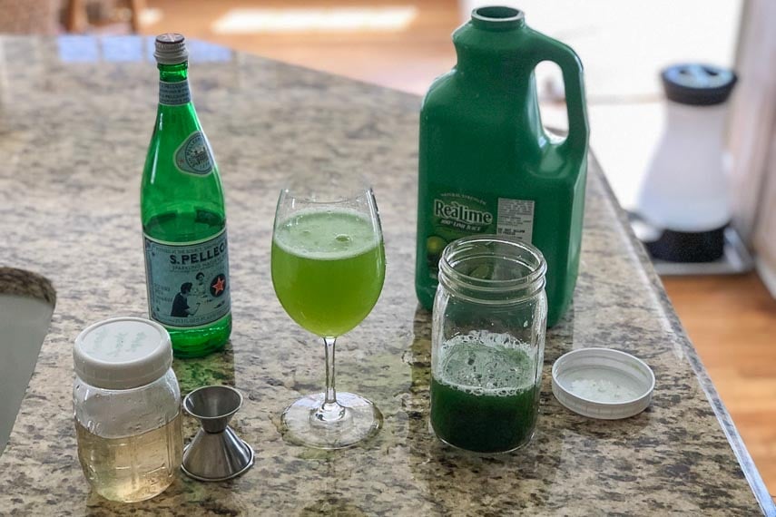 Cucumber Mint Lime Agua Fresca ingredients on granite counter in sunlight