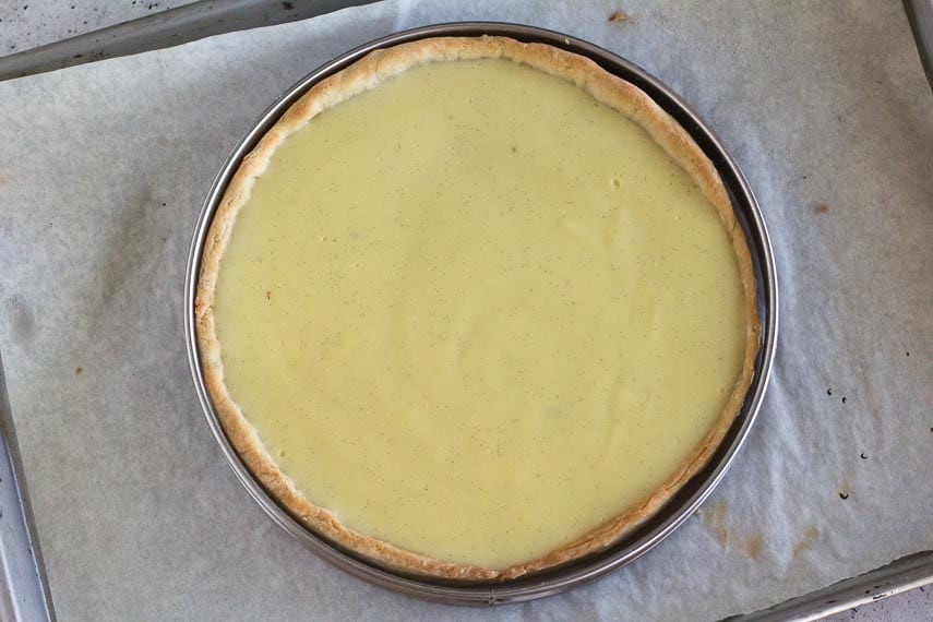 lactose-free pastry cream in tart shell on sheet pan in a ring-style tart ring (pan)