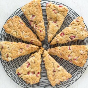 rhubarb scones on a black wire cooling rack