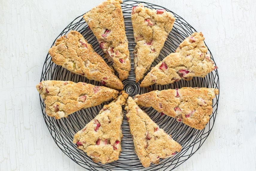 rhubarb scones on a black wire cooling rack