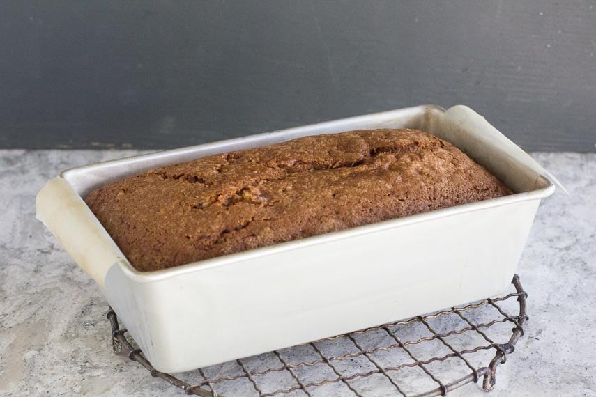 FODMAP IT Nana's banana bread in loaf pan cooling on a rack