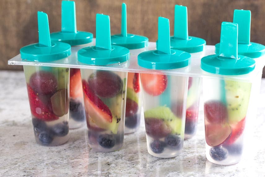 Coconut Water & Fresh Fruit Popsicles in mold before they are frozen