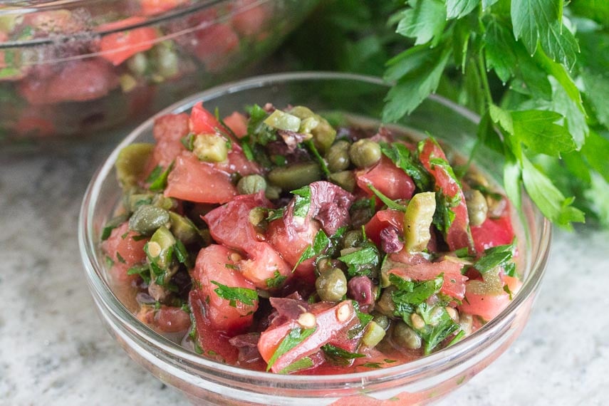 Tomato Olive Salsa in a clear glass bowl
