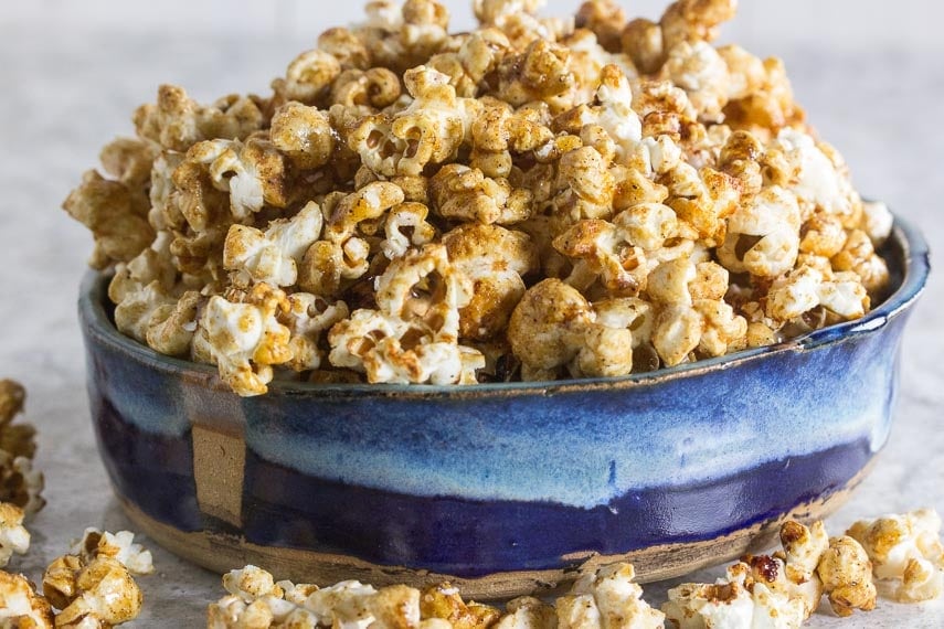 Sweet n spicy kettle corn in a shallow blue ceramic bowl