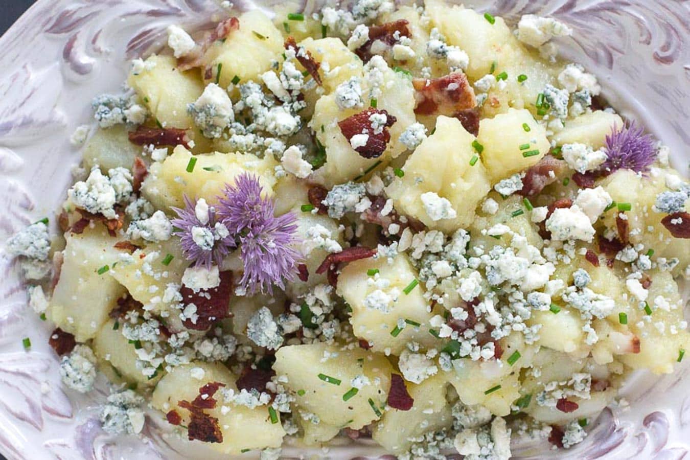 closeup image of Potato Salad with Bacon, Chives & Blue Cheese in decorative white bowl bacon potato salad with blue cheese edit