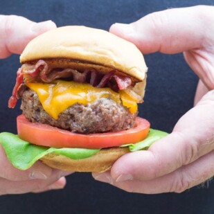 Our Best Low FODMAP burger in two male hands