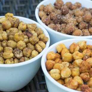 roasted chickpeas on outdoor table in 3 white bowls