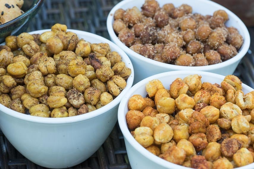 roasted chickpeas on outdoor table in 3 white bowls