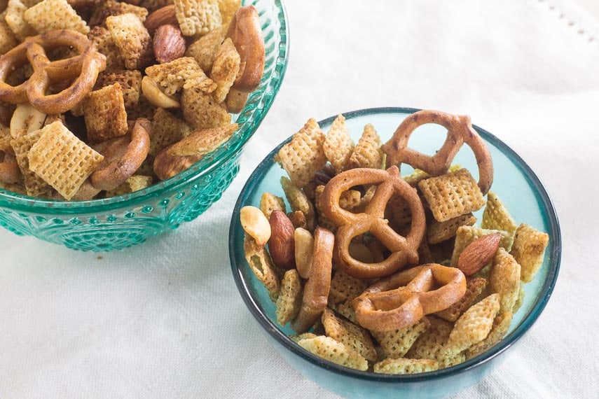 two teal glass bowls of low FODMAP Chex Mix snack