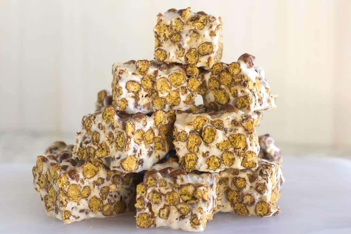 Chocolate Toasted Marshmallow Treats on a white surface closeup of Chocolate Toasted Marshmallow Treats on white background.