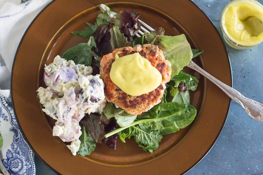 aioli on salmon burger and in a small glass dish