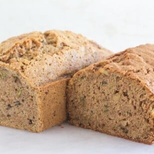 loaves of Zucchini bread on a white surface